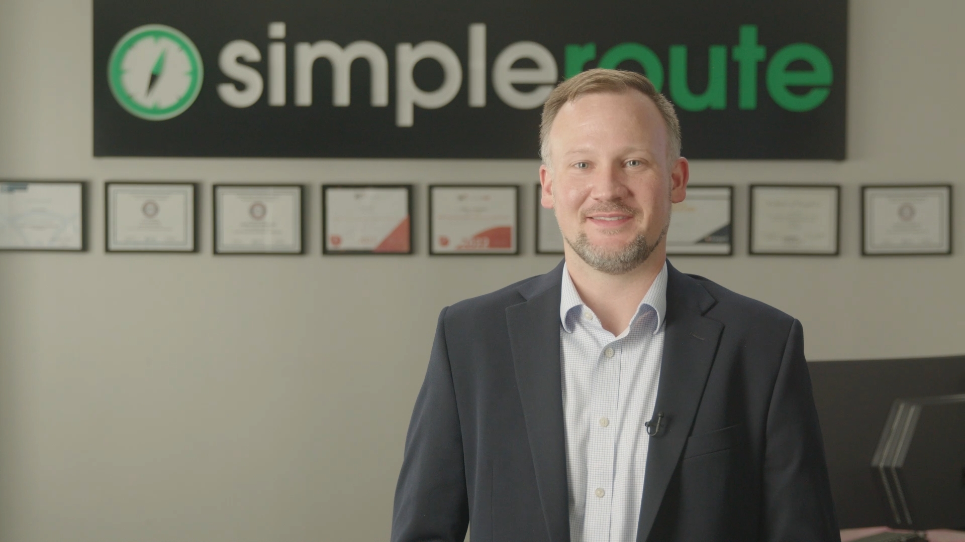 Brett standing in the simpleroute office