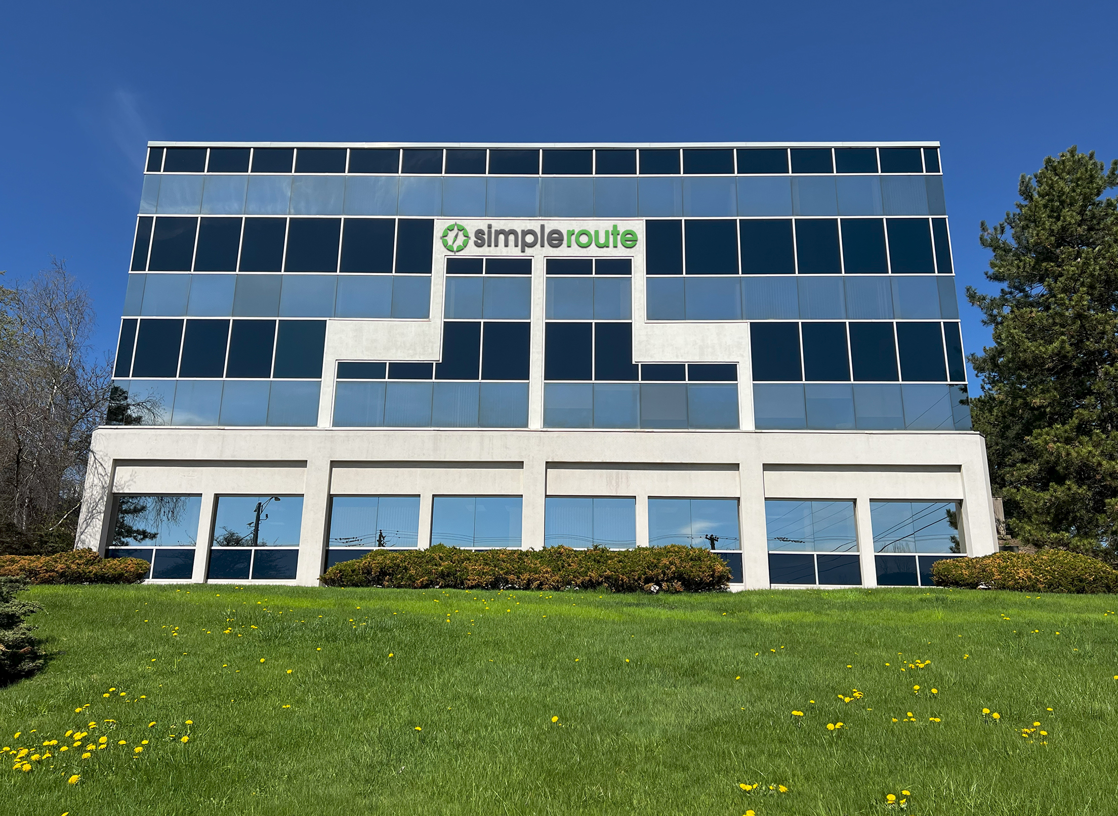 Open concept office with employees working at their desks